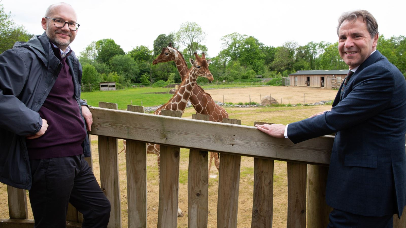 Metro Mayor Dan Norris (right), joins Dr Justin Morris, Chief Executive of Bristol Zoological Society, and meets the giraffes at Wild Place Project